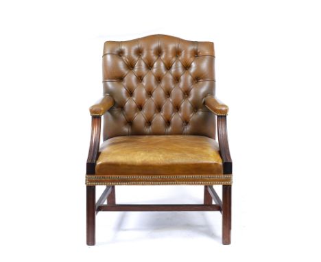 A GEORGE III STYLE GAINSBOROUGH LEATHER BUTTON UPHOLSTERED OPEN ARMCHAIR with fluted curving arm supports and conforming legs
