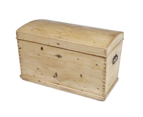 AN ANTIQUE PINE DOME TOPPED TRUNK with wrought iron carrying handles to the side 93cm wide x 56cm high x 55.5cm deep 