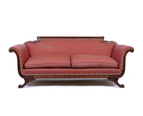 A REGENCY STYLE SOFA with reeded cresting rail, scroll arms and splaying paw feet to the front, 205cm wide x 83cm high