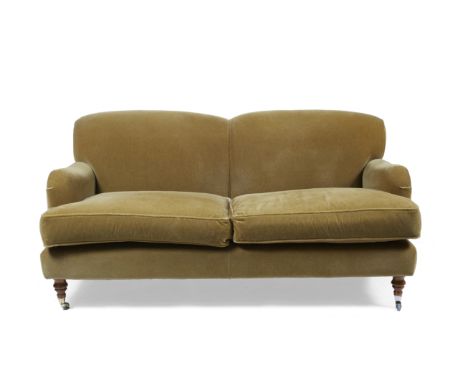 A CONTEMPORARY GEORGE SMITH GREEN MOHAIR UPHOLSTERED SOFA with feather filled loose cushions to the seat and standing on turn