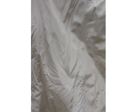 A PAIR OF CREAM GRAIN EFFECT LINED CURTAINS, 169cm at the widest point x 216cm drop for each curtain
