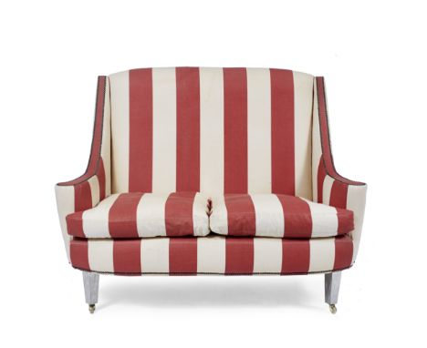 A CONTEMPORARY TWO SEATER SOFA designed by Christopher Neville, with a high back, red and white striped upholstery with squab