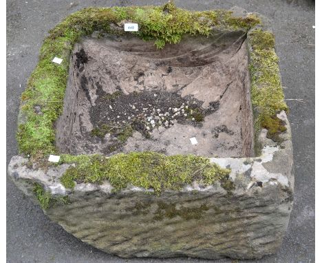 A square hewn stone trough. 34cm high x 66cm.