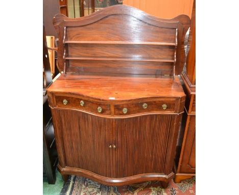 A late 18th/early 19th century mahogany serpentine fronted klap buffet, hinged top enclosing a collapsible superstructure, ab