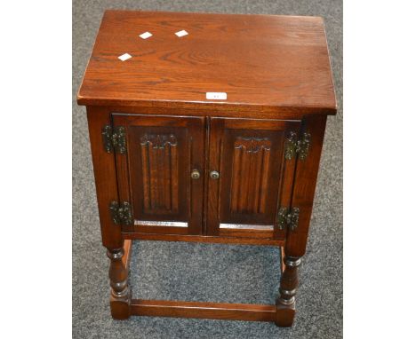 An Old Charm oak pedestal cabinet model 1582. 71.5cm high x 50cm wide x 35cm deep.