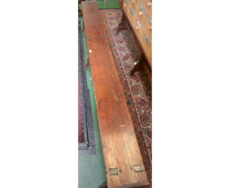 A Victorian pine bench 252cm long x 46cm high 