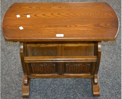 An Old Charm oak magazine rack/occasional table model