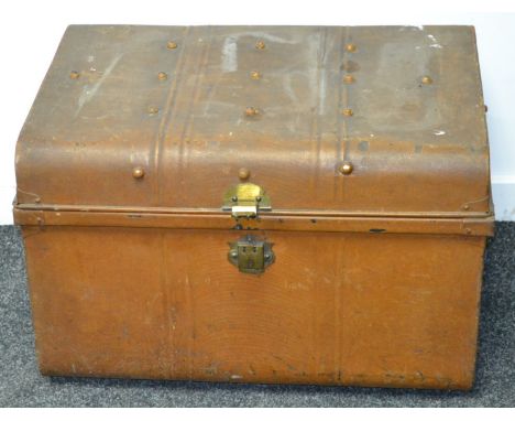 A dome top tin trunk.