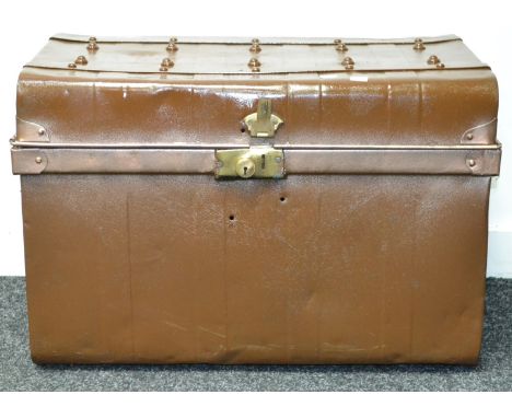 A vintage tin dome top trunk.