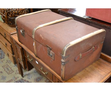 A vintage travel trunk, leather handles, wood surround