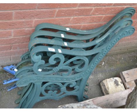 Two pairs of cast metal bench ends; three cast metal wall brackets.(7)