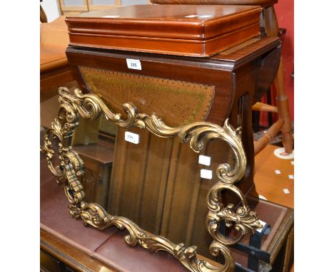 A small mahogany dropleaf table, tooled leather surface; a canteen of flatware; a gilt framed mirror; a hearth/grate guard