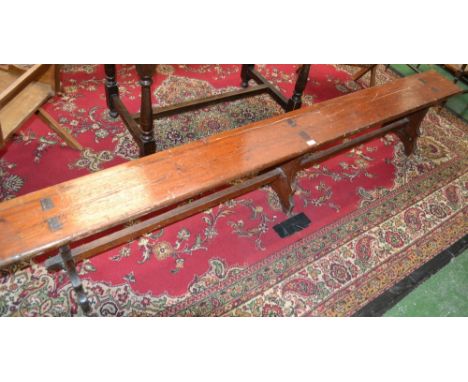 A Victorian pine bench 244cm long x 46cm high 