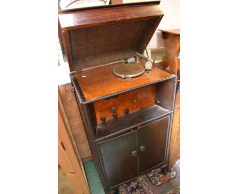 An early 20th century oak-cased record player and radio.