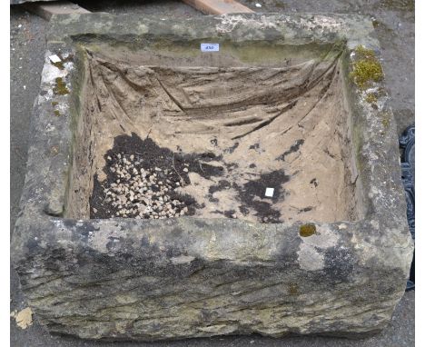 A hewn stone trough. 38cm high x 70cm x 60cm