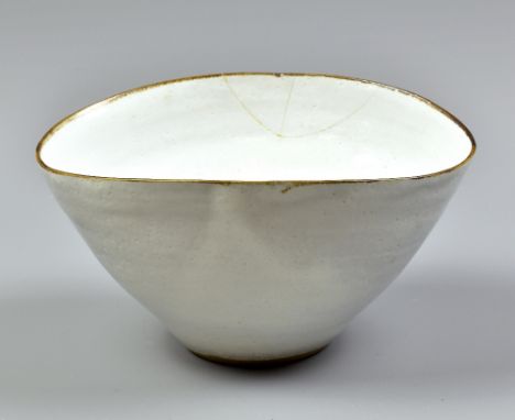 DAME LUCIE RIE (1902-1995); a squeezed stoneware bowl covered in white glaze with manganese rim, impressed LR mark, maximum d
