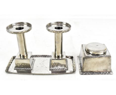 HUGH WALLIS (1871-1943); an Arts and Crafts pewter four piece desk set comprising inkwell of square form, pair of ejector can