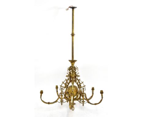 AFTER BENHAM &amp; FROUD; an Aesthetic Movement brass five branch ceiling light, the central circular body relief decorated w