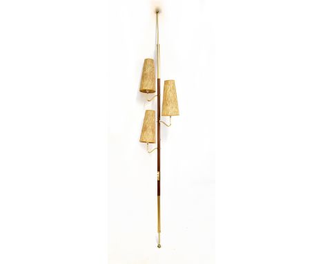 A teak tension pole lamp with three lights and conical wicker shades, overall height 252cm.Additional InformationSome surface