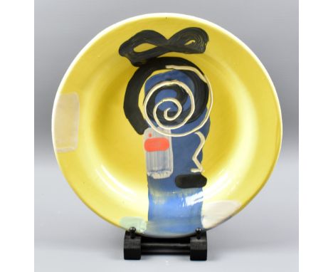 BRUCE McLEAN (born 1944); a large earthenware plate with brush and incised decoration on pale yellow ground, painted signatur