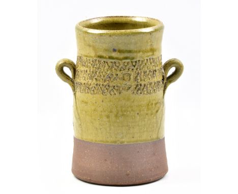 MATTHEW FOSTER for Leach Pottery; a lugged stoneware vessel partially covered in green ash glaze with incised decoration, imp