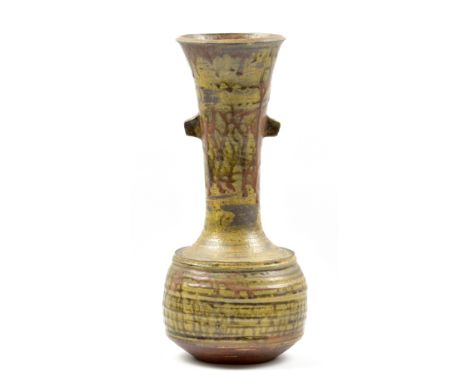 JANET LEACH (1918-1997) for Leach Pottery; a tall stoneware lugged bottle covered in green ash glaze with trailed iron decora