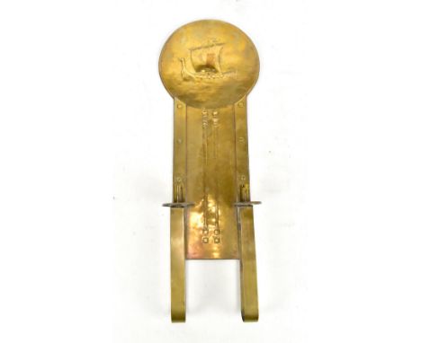 An Arts and Crafts brass wall light, possibly Scottish school, with embossed decoration depicting a galleon above stylised mo