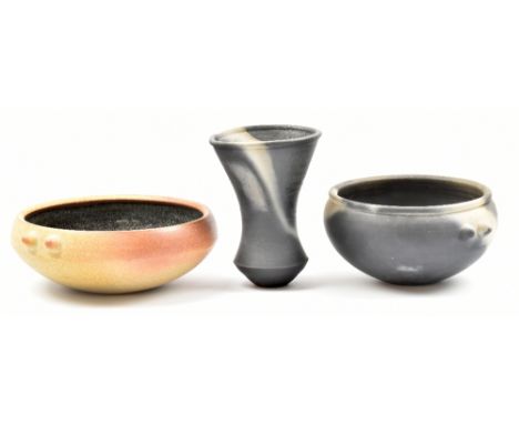 JOHN LEACH (born 1939) for Muchelney Pottery; a 'Black Mood' tapered vase and lugged bowl, and a stoneware lugged bowl with t