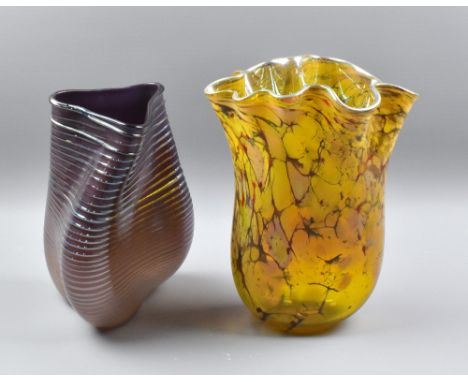 Two art glass vases, the purple example with ribbed detail, unsigned, height 28cm, the second with mottled amber body and cri