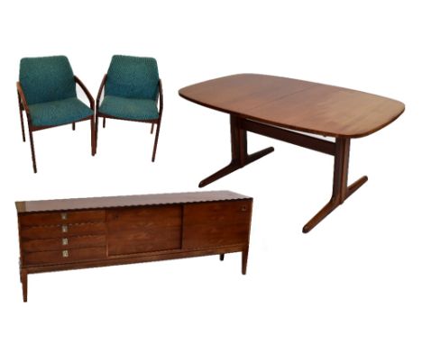 A rosewood dining suite comprising Dyrlund extending dining table with one extra leaf, six Danish open sided armchairs, a sid