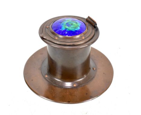 JESSON BIRKETT; an Arts and Crafts copper inkwell, the cover with blue and green enamel&nbsp;cabochon enclosing ceramic liner