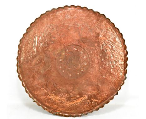 ATTRIBUTED TO FIVEMILETOWN; an Arts and Crafts copper charger of circular form, with piecrust edge and planished and chased d
