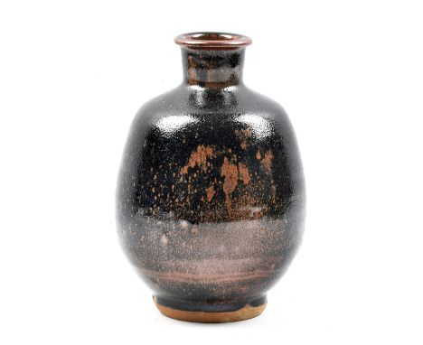 JIM MALONE (born 1946); a stoneware bottle covered in tenmoku breaking to kaki glaze, impressed JM and A for Ainstable marks,