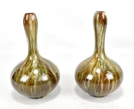 LINTHORPE; a pair of drip glazed bottle vases in the manner of Christopher Dresser, one bearing factory mark and both numbere