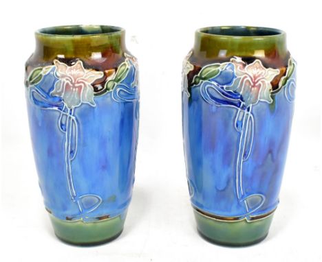 BOURNE DENBY; a pair of Art Nouveau cylindrical vases, with tube lined floral decoration and printed factory marks to base, h