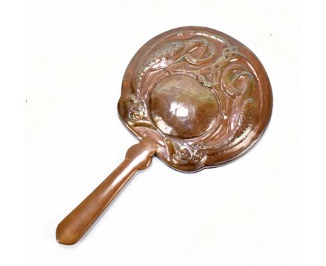An Arts and Crafts copper dressing table hand mirror, repoussé decorated with two birds and a central Celtic knot, length 33c