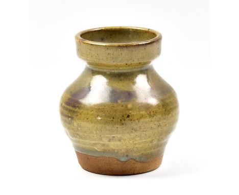 WILLIAM STAITE MURRAY (1881-1962); a squat stoneware vase with pronounced collar covered in olive green glaze with brushed co