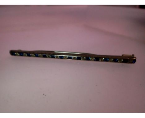 White metal Art Deco bar brooch set with blue and white stones, L: 90 mm. UK P&amp;P Group 0 (£6+VAT for the first lot and £1