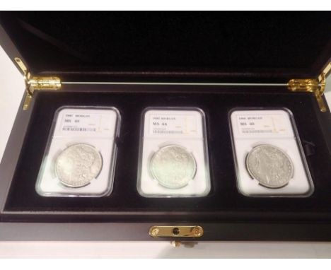 Three replica Morgan dollars, slabbed and boxed. UK P&amp;P Group 0 (£6+VAT for the first lot and £1+VAT for subsequent lots)