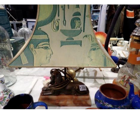 Egyptian decorated sphinx table lamp on onyx base. All electrical items in this lot have been PAT tested for safety and have 