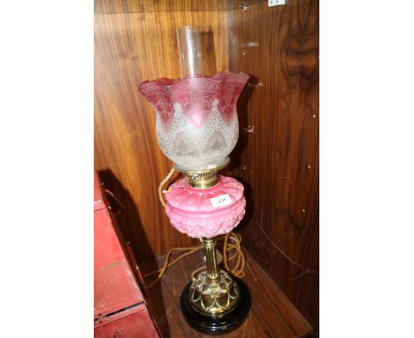 A VINTAGE PINK GLASS CONVERTED OIL LAMP WITH SHADE