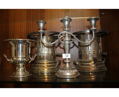 A PAIR OF SILVER PLATED PLATE WARMERS TOGETHER WITH A SMALL CHAMPAGNE BUCKET AND A THREE BRANCH CANDLESTICK (4) 
