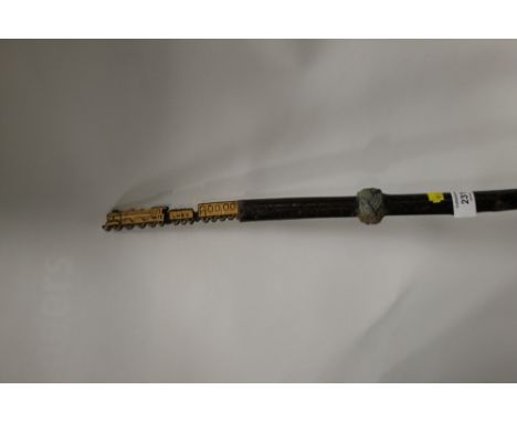 A VINTAGE WALKING CANE WITH CARVED FLYING SCOTSMAN POMMEL