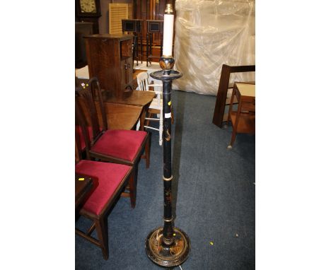 AN EBONISED LAMP STANDARD