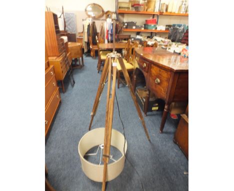 A MODERN TRIPOD STYLE STANDARD LAMP WITH SHADE