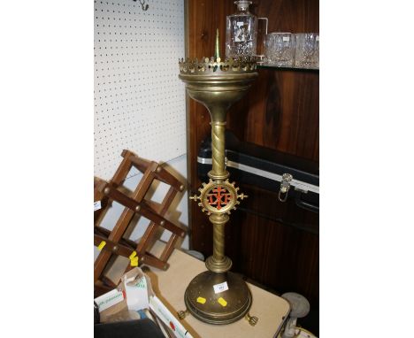 A LARGE ECCLESIASTICAL BRASS CANDLESTICK  