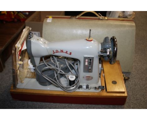 A CASED VINTAGE JONES SEWING MACHINE 