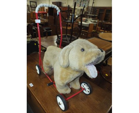 A VINTAGE CHILDS PUSH ALONG DOG TOY