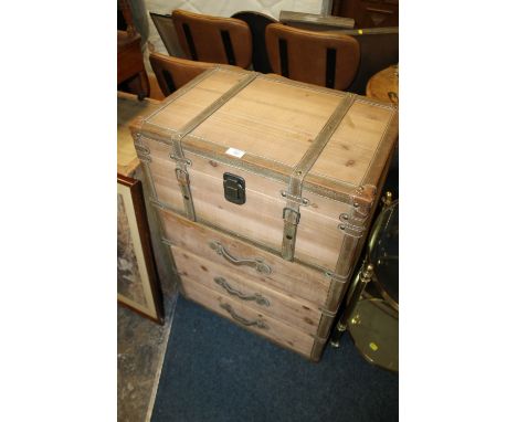 A MODERN CABINET WITH THREE DRAWERS FORMED AS A PACKING TRUNK