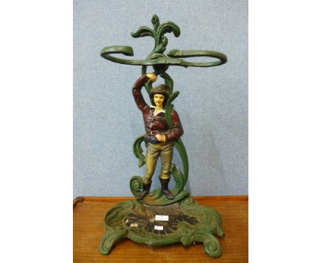 A painted cast iron figural stick stand 